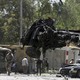U.S. soldiers lift car wreckage with a crane in Kabul, Afghanistan.