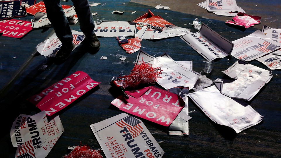 Debris and signs are left on the floor after the victory party for Republican president-elect Donald Trump in New York on November 9, 2016.