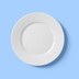 An empty white plate on a blue background