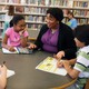 Stacey Abrams speaks with a group of children