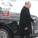 Russian President Vladimir Putin walks past his limousine
