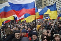 Demonstrators hold Russian and Ukrainian flags.