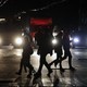 People cross a road during a power outage in the Crimean city of Simferopol on November 24, 2015.