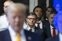 Speaker of the House Mike Johnson, businessman Vivek Ramaswamy, and Representative Cory Mills stand behind Trump as he speaks to the media