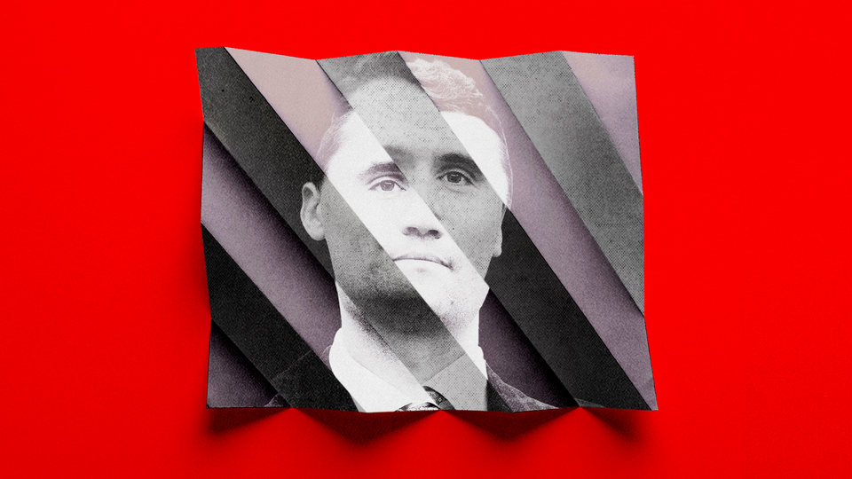 A photograph of a white man in a suit that looks is diagonally creased in many places.