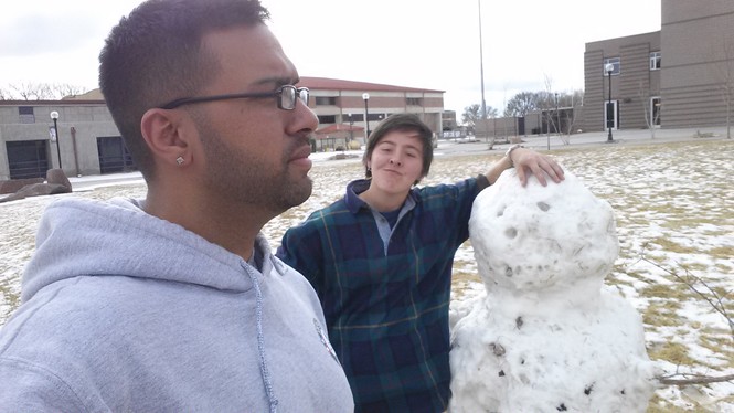 Jesse and Hiren with a snowman