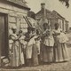 A photograph showing women holding babies