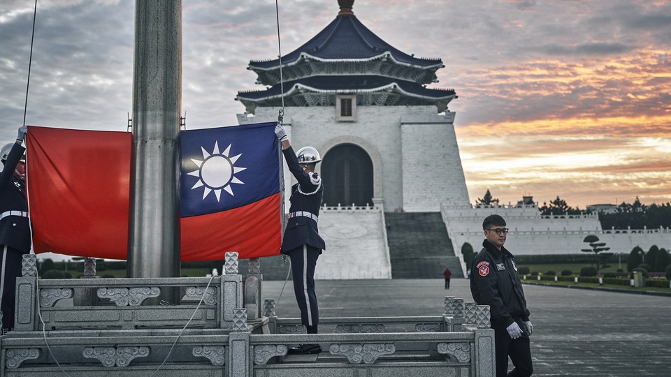 An honor guard during a flag raising ceremony at Chiang Kai Shek Memorial Hall in Taipei, Taiwan, on Wednesday, Dec. 27, 2023. Next month Taiwan holds presidential and legislature elections that will help shape US-China relations for years to come.