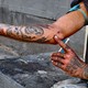 A drug user prepares to inject himself