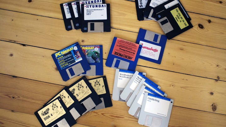 Floppy disks arranged on a wood floor