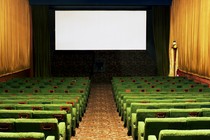 Illustration of an empty movie theater and a blank screen