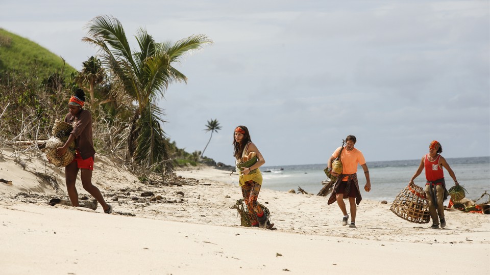 Season 33 of Survivor, showing people walking on a beach