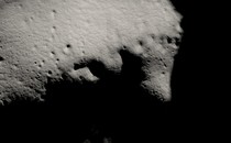 An image of the moon's south pole, slate-colored and covered in shadows