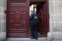 A police officer enters the residence on the Rue Tronchet in Paris, France, where Kim Kardashian West was robbed. 