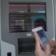 A message demanding money is seen on a monitor of a payment terminal at a branch of Ukraine's state-owned bank Oschadbank after Ukrainian institutions were hit by a wave of cyberattacks on June 27, 2017.