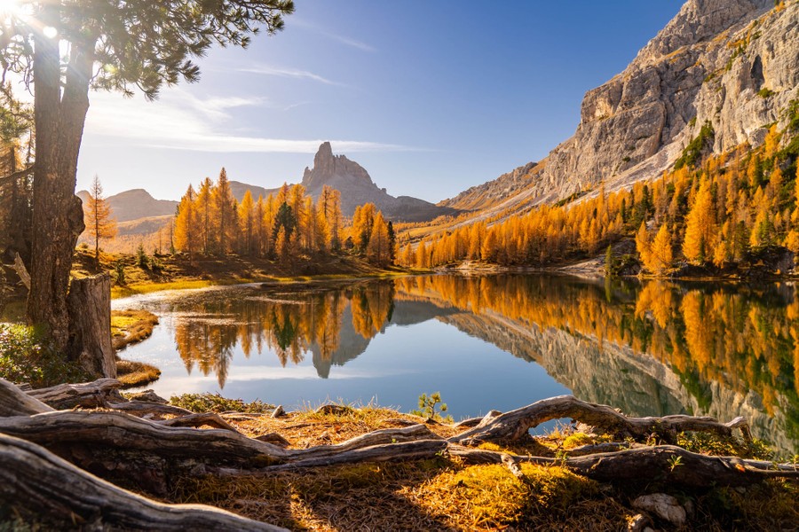 A sunny autumn view across a small mountain lake