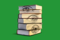 A stack of books with eyes on the pages