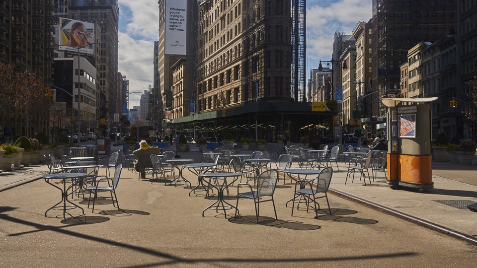 Empty outdoor tables near Madison Square Park, in Manhattan