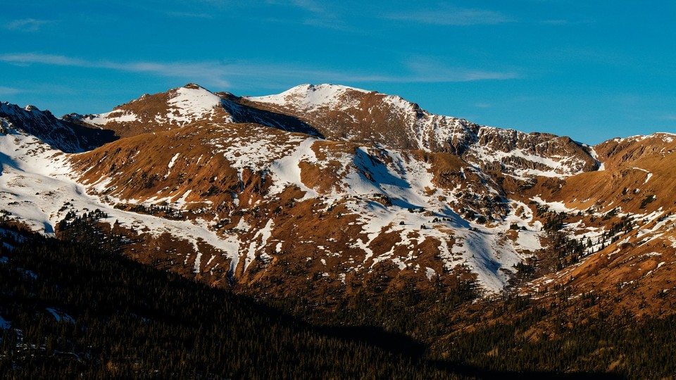 Colorado mountains sparsely covered with snow