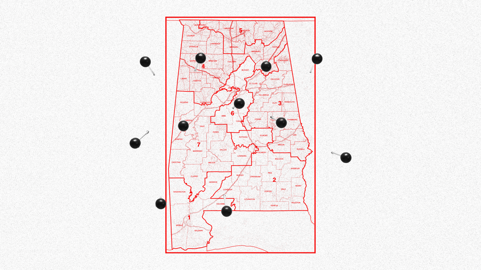 A map of Alabama with pins in it.