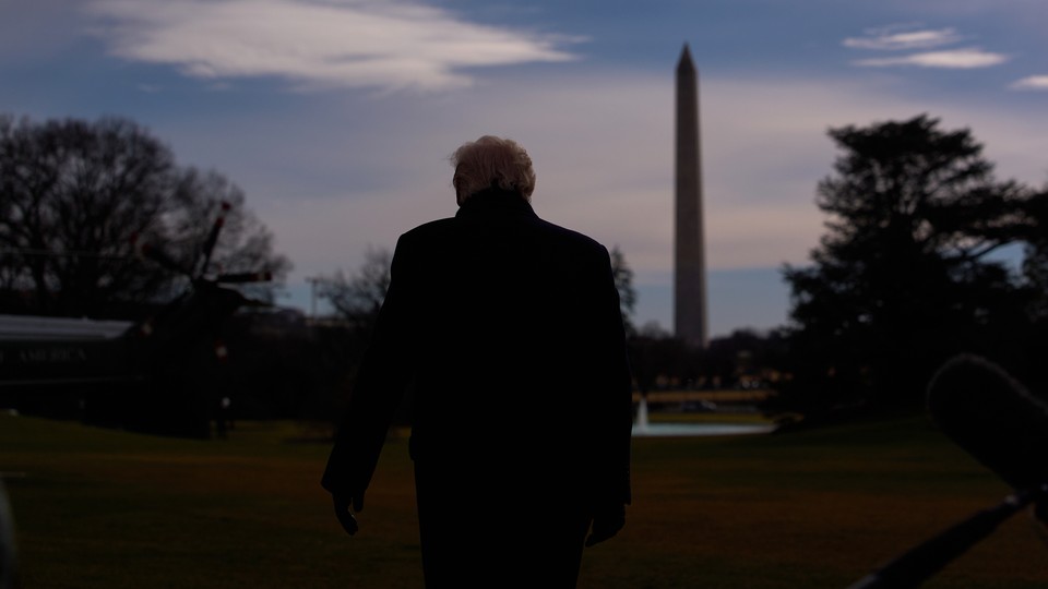 trump's back with washington memorial in the background