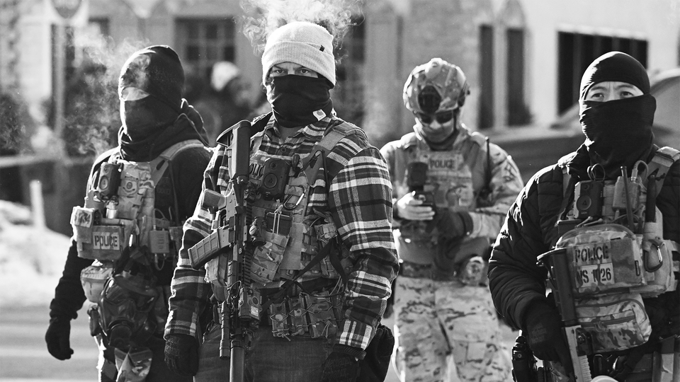 Federal agents near the site of where Alex Pretti was shot in Minneapolis