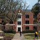 Two students walk near a building at Prairie View A&M University.