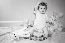 photograph of child playing with toys