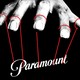 An illustration of a giant hand puppeteering the brand logo of Paramount