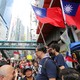 Protesters wave Taiwanese flags at a rally in Hong Kong.