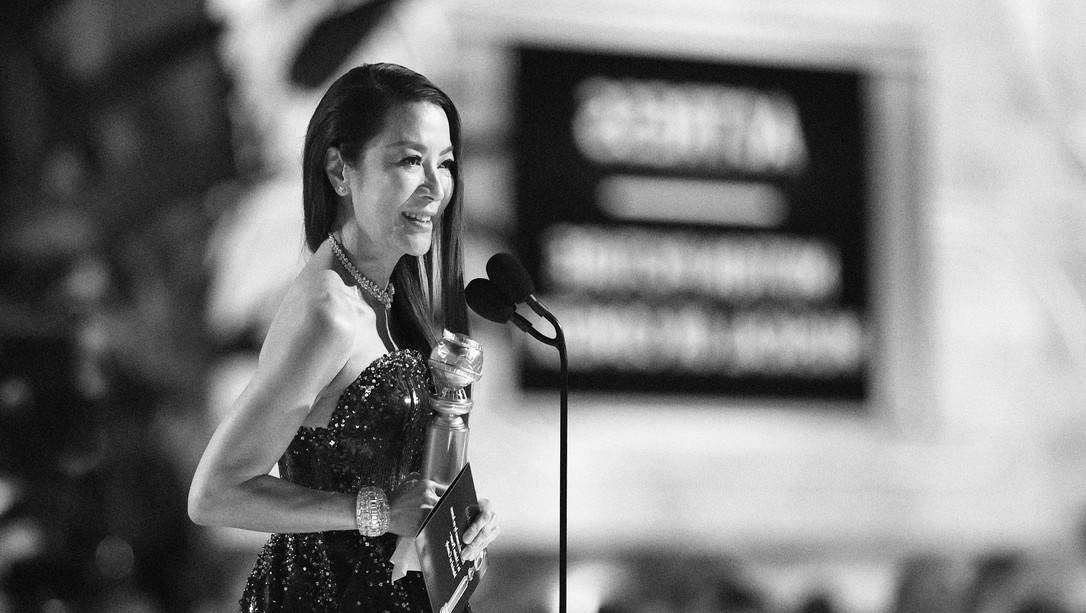 black-and-white photo of Michelle Yeoh accepting her Golden Globe