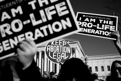 Anti-abortion-rights signs at a protest