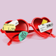 Red heart-shaped sunglasses affixed with price-tag stickers