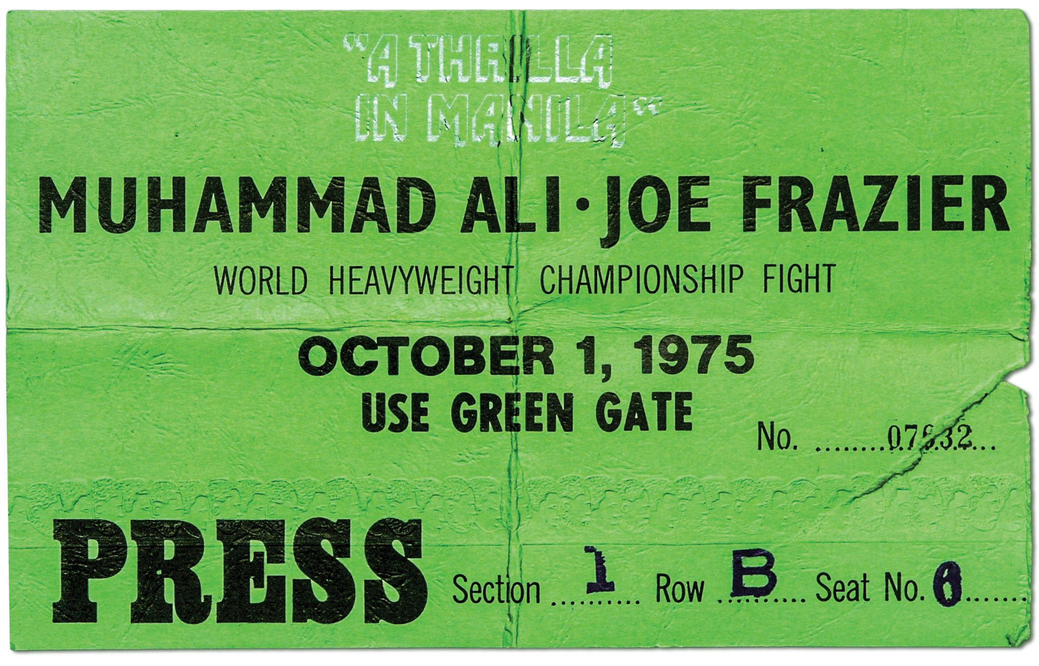 scan of an unfolded green paper press-pass ticket for A THRILLA IN MANILA with date and seat info