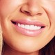 Bottom half of a smiling woman's face