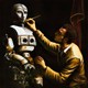 Illustration in an old painting style of a man building a robot