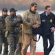 A photo of Nicolas Maduro being escorted by U.S. agents