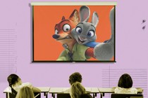 A frame from Disney's "Zootopia" is superimposed on a projector screen in a classroom.