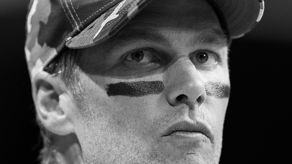 A black-and-white photo of Tom Brady