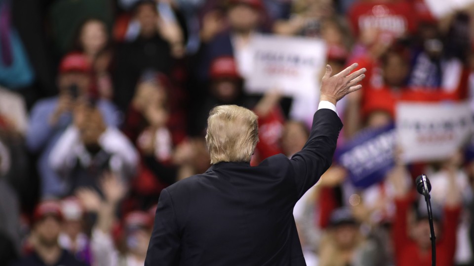 Donald Trump waves to a crowd