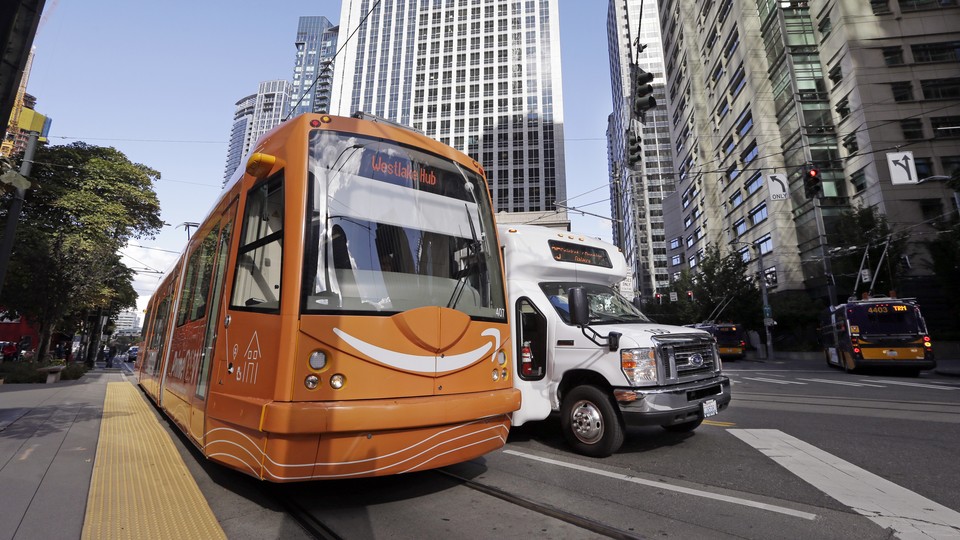 A streetcar with the Amazon logo on a Seattle street