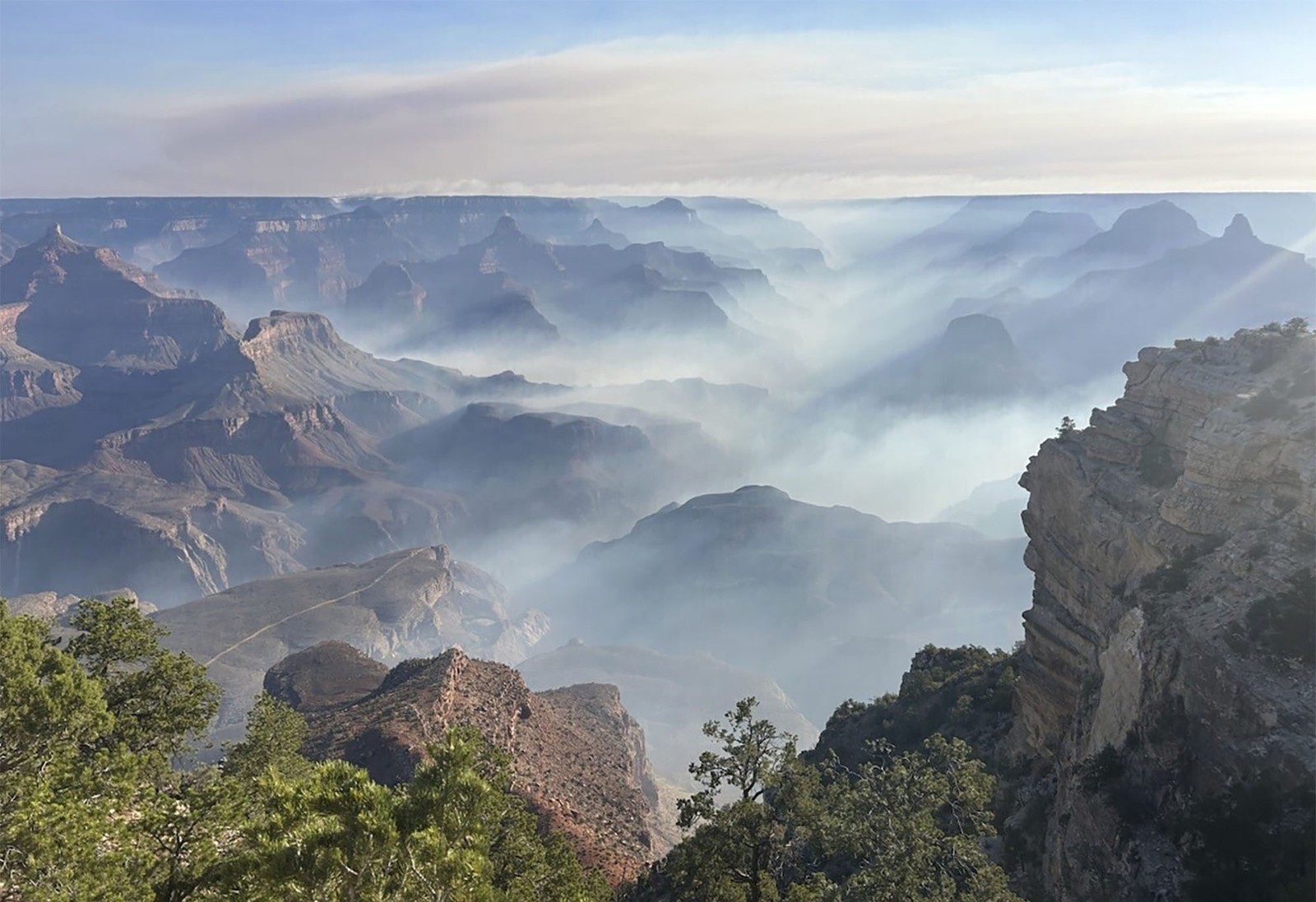 Smoke from wildfires settles into the valleys of the Grand Canyon.