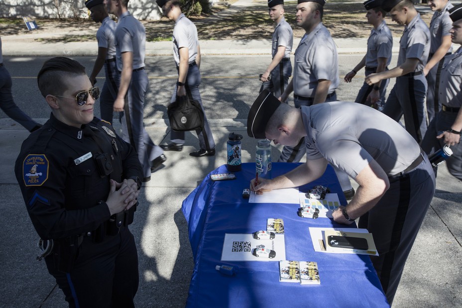 Picture of officer Terry Cherry of the Charleston Police Department standing at her recruiting table at the Citadel in Charleston, SC on Feb. 22, 2023.