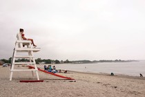 A female lifeguard overlooks the ocean