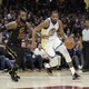 The Golden State Warriors' Kevin Durant goes to the basket against the Cleveland Cavaliers' LeBron James in the first half of Game 4 of basketball's NBA Finals on June 8, 2018, in Cleveland
