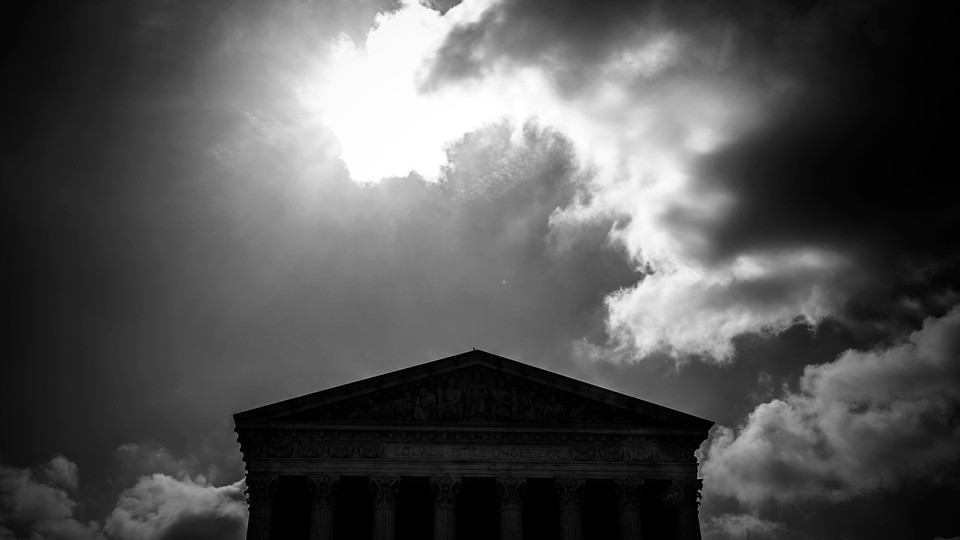 Supreme Court building on a cloudy day