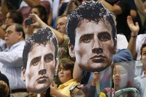 Fans at the 2012 London Olympics hold cutouts of U.S. Olympic swimmer Ryan Lochte.