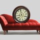A chaise with a large clock placed on it