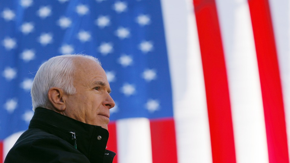 John McCain in front of an American flag