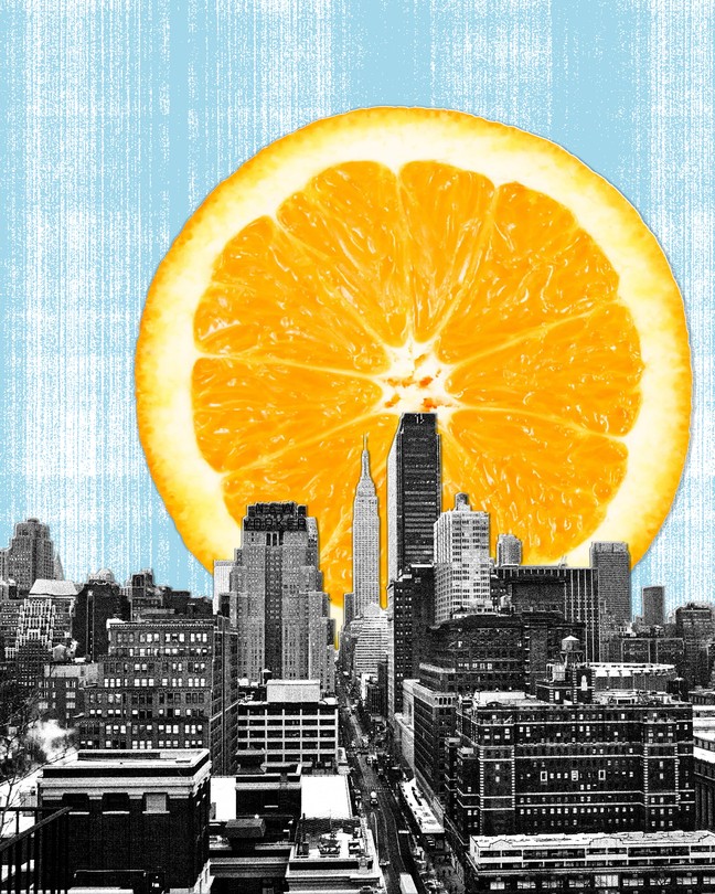 A slice of orange rising over NYC skyline mimicking a sun